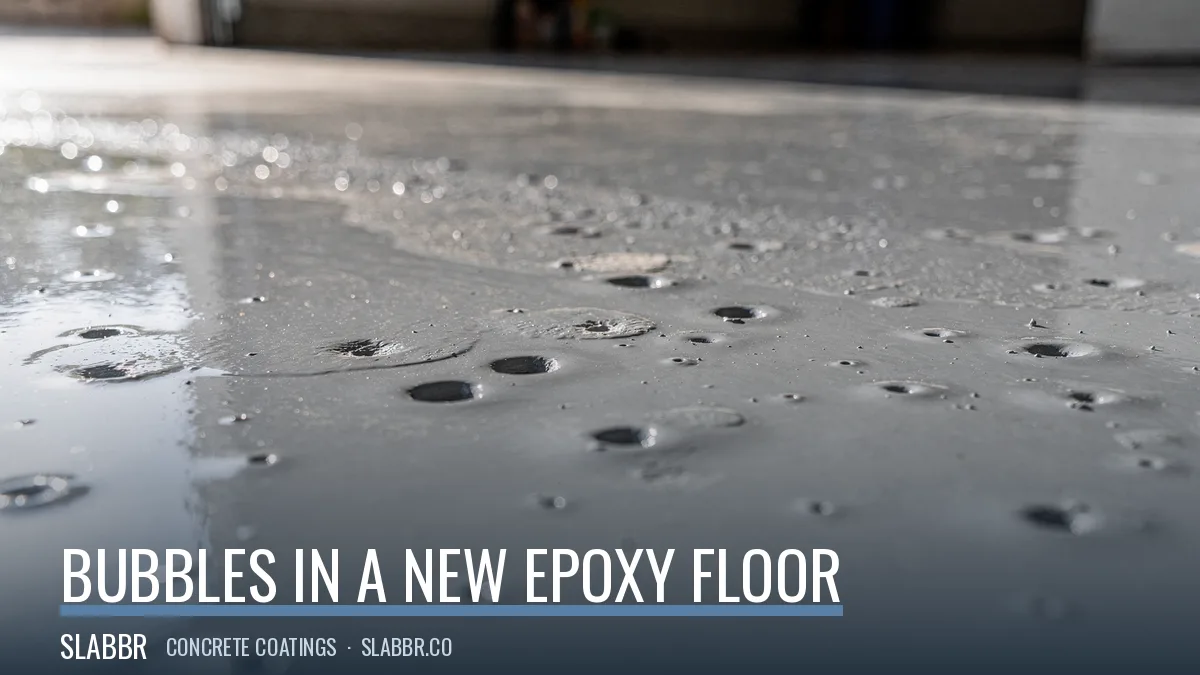 Bubbles and pinholes across a freshly coated epoxy garage floor