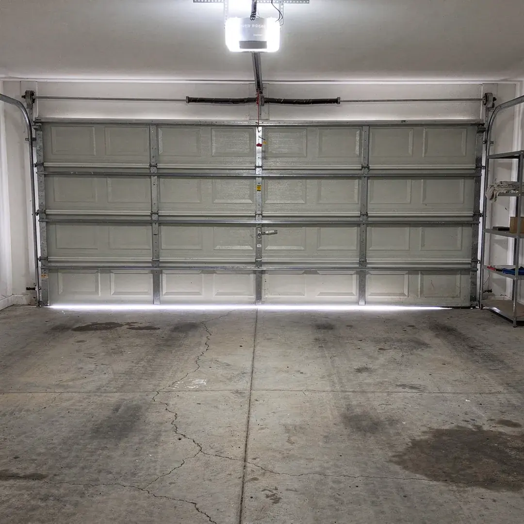 Bare gray concrete garage floor before coating