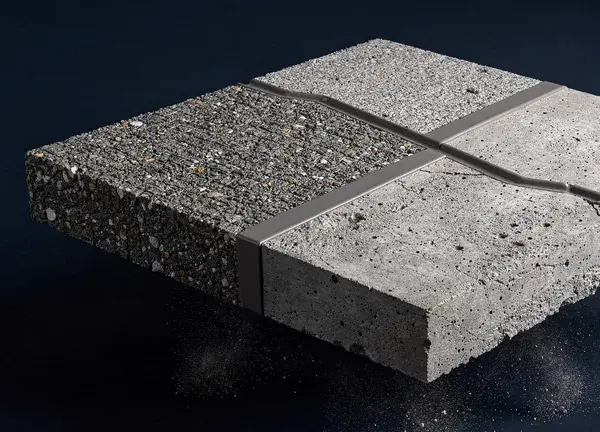 The same slab half diamond ground to a clean open profile, with a crack chased into a V groove and filled flush with a rigid repair polymer.